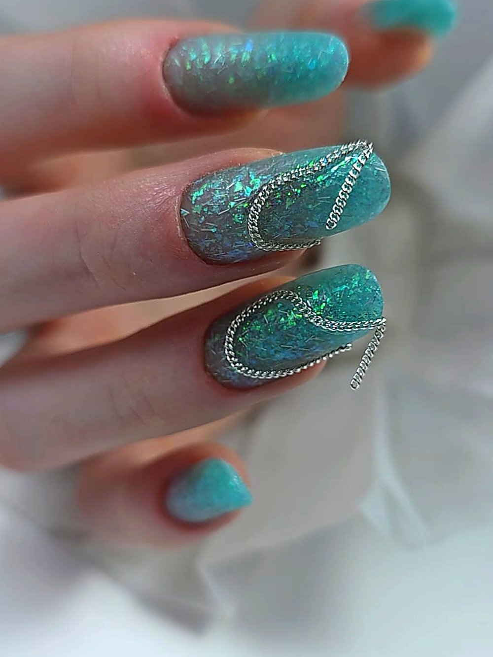 Opal turquoise nails with chain detail