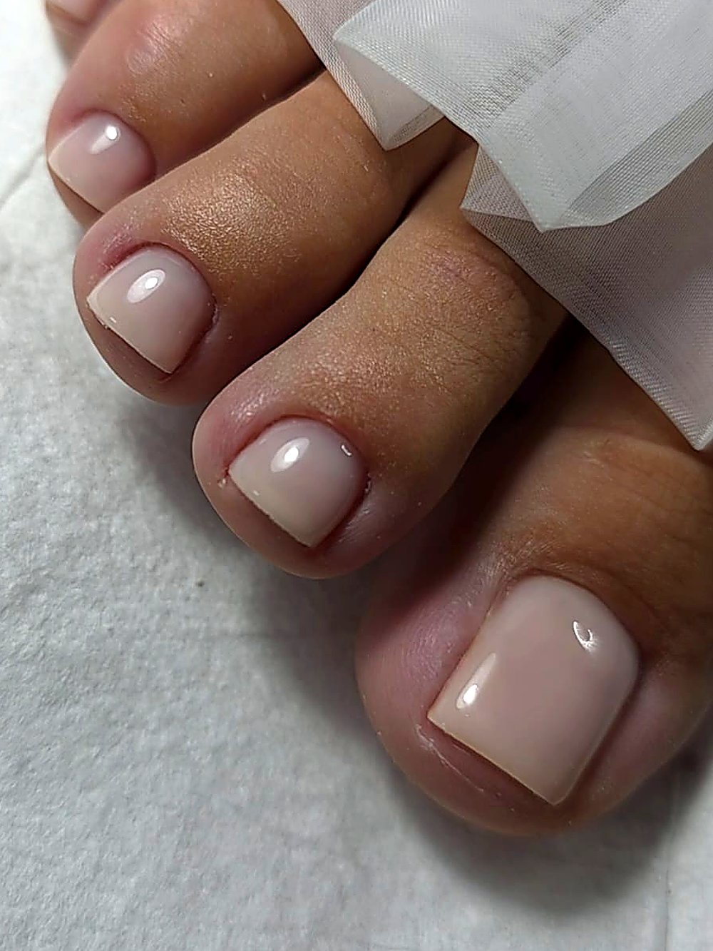 Gel polish pedicure, nude finish
